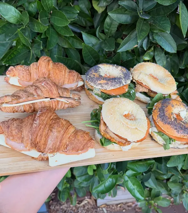 Board of filled croissants and bagels